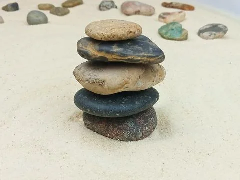 Stack of stones on sand Stock Photos