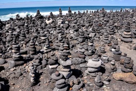 Stack of stones on the sea beach Stock Photos
