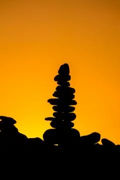 Stack of stones on the sea beach Stock Photos