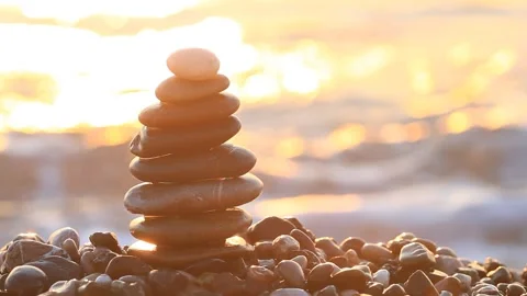 Stack of a stones on the sea beach at sunrise Stock-Footage 91362484