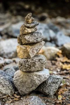 Stack of stones by a stream in the park Foto stock