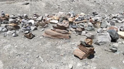 Stack of stones on top of the mountain arranged for meditation. Stock Photos