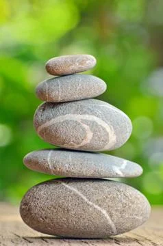 Stack of Stones on a wooden table Foto stock