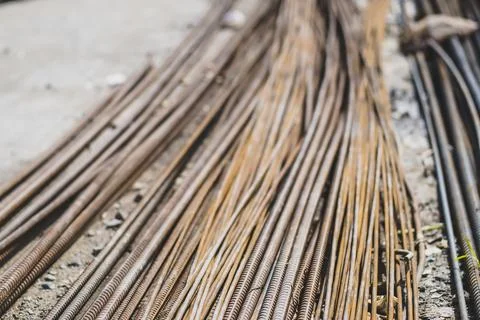 Stack of straight old rusty high yield stress deformed reinforcement steel .. Stock Photos