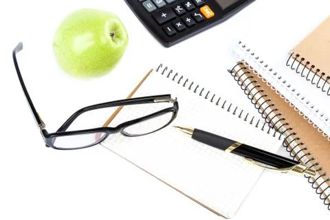 Stack stylish notebook, pen and glasses Office or school supplies Stock Photos