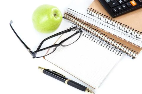 Stack stylish notebook, pen and glasses Office or school supplies Stock Photos