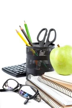 Stack stylish notebook, pen and glasses. Office or school supplies. Stock Photos