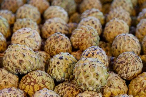 Stack of Sugar apples on a market stall Stock Photos