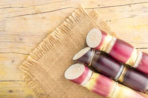 Stack of sugar cane on the table Stock Photos