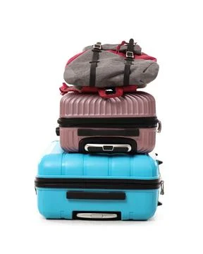Stack of suitcases and backpack isolated on white background Stock Photos