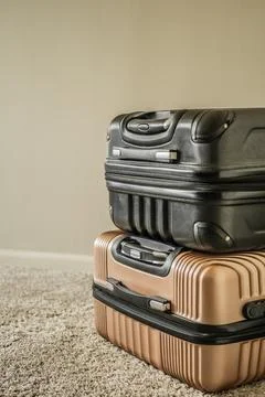 Stack of suitcases on carpet background Stock Photos