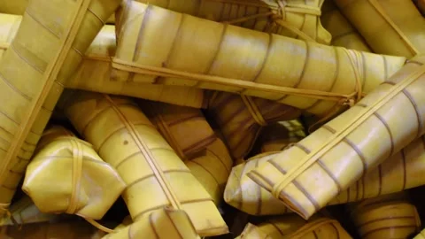 Stack of Suman. Sticky rice cake wrapped in palm leaves. Traditional Filipino fo Stock Footage 198321584