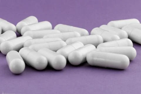 A stack of supplement capsules, dietary supplements, vitamin tablet. Stock Photos