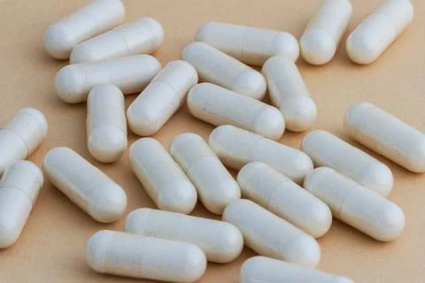 A stack of supplement capsules, dietary supplements, vitamin tablet. Stock Photos