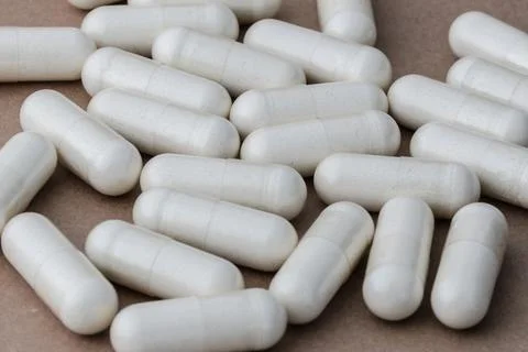 A stack of supplement capsules, dietary supplements, vitamin tablet. Stock Photos