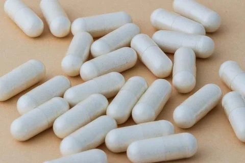A stack of supplement capsules, dietary supplements, vitamin tablet. Stock Photos