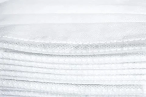 Stack of surgical face masks,background white and blue Stock Photos