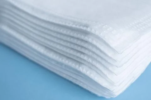 Stack of surgical face masks,background white and blue Stock Photos