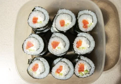 A stack of sushi in a container Stock Photos
