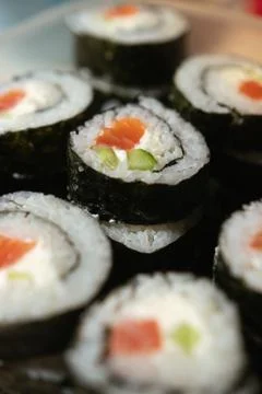 A stack of sushi in a container. sushi with fish close-up. Stock Photos
