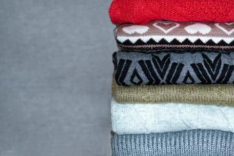 Stack of sweaters, jumpers Stock Photos