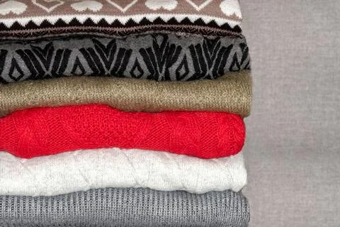 Stack of sweaters, jumpers Stock Photos