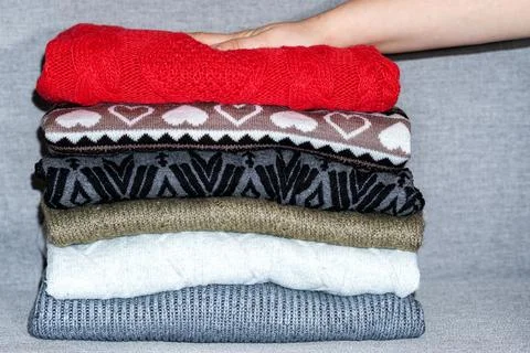 Stack of sweaters, jumpers Stock Photos