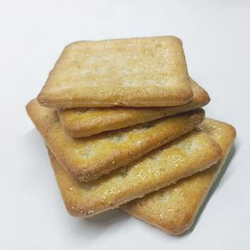 Stack of Sweet Sugar Glazed Crackers Isolated on White Background Stock Photos