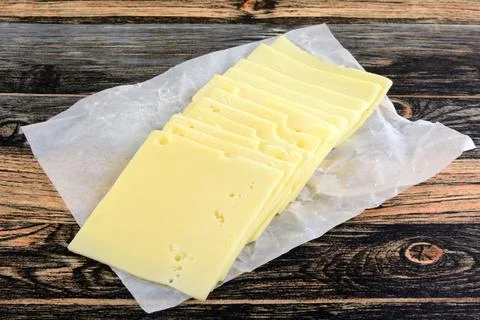 Stack of Swiss cheese slices Stock Photos