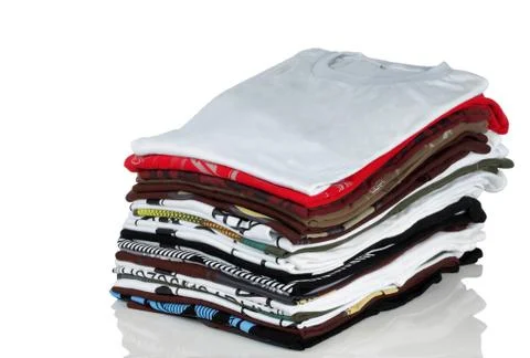 Stack of t-shirt and clothes Stockfoto's