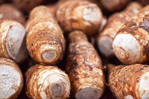 Stack of taro on a market stall Stock Photos