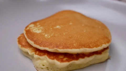 Stack of tasty pancakes on the plate for breakfast. Homemade pancakes. Stock Footage 158661220