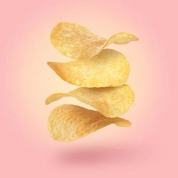 Stack of tasty potato chips falling on pink background Stock Photos