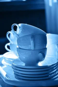 Stack of teacups in blue color of the year Stock Photos