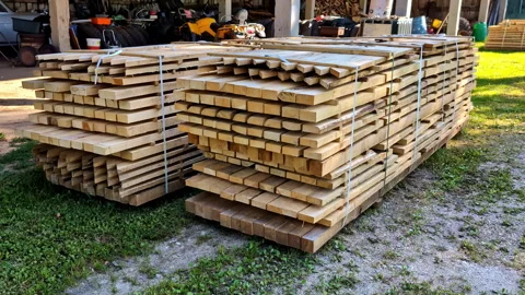 Stack Of Teak Wood Boards Ready For Delivery At Lumber Yard. dolly-in shot Vídeo Stock 285481138