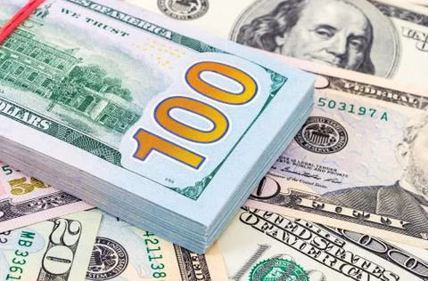 Stack of ten thousand american dollars close up. Fragment Stock Photos