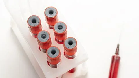 Stack of test tubes and syringe. Doping Test, Tubes with athlete's blood taken f Stock Photos