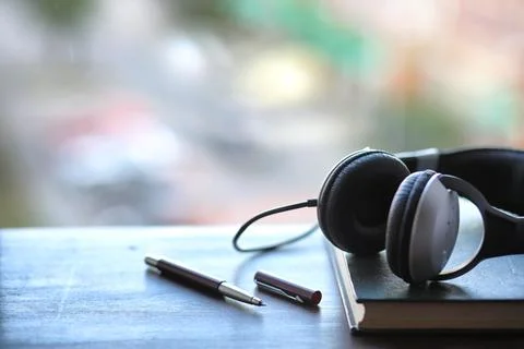 A stack of textbooks headphone Stock Photos