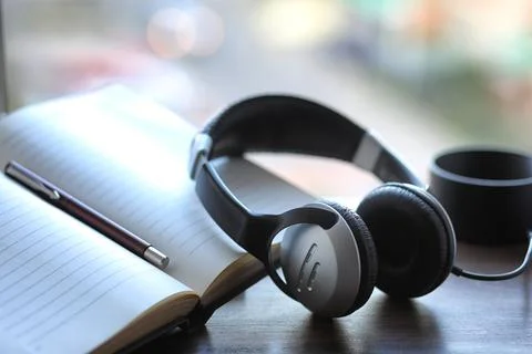 A stack of textbooks headphone Stock Photos