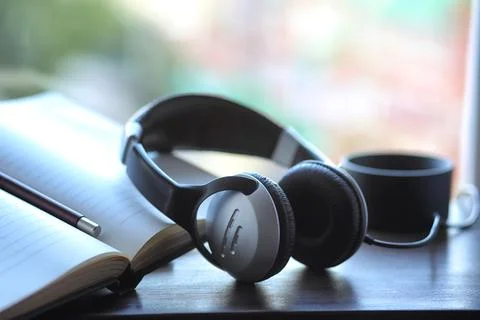A stack of textbooks headphone Stock Photos