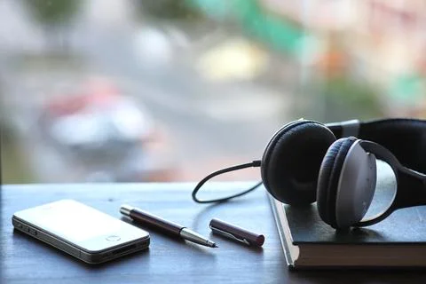 A stack of textbooks headphone Stock Photos