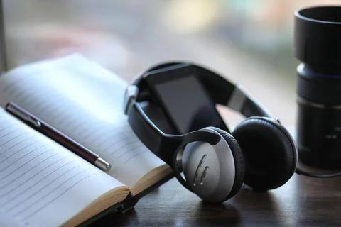 A stack of textbooks headphone Stock Photos