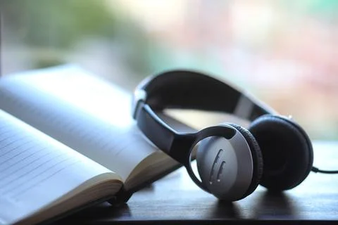 A stack of textbooks headphone Stock Photos