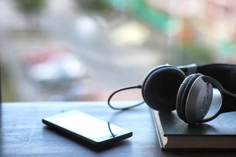 A stack of textbooks headphone Stock Photos
