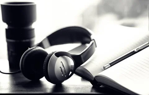 A stack of textbooks with headphone Stock Photos