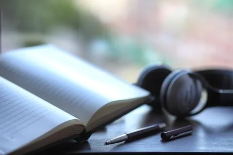 A stack of textbooks headphone Stock Photos