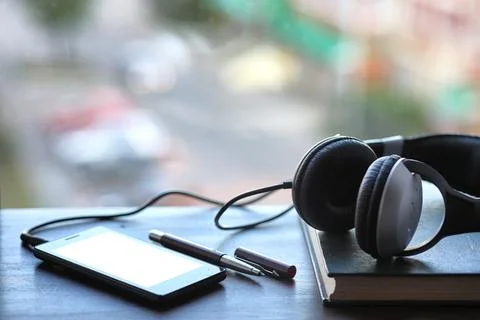 A stack of textbooks headphone Stock Photos