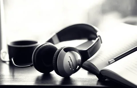 A stack of textbooks with headphone Stock Photos