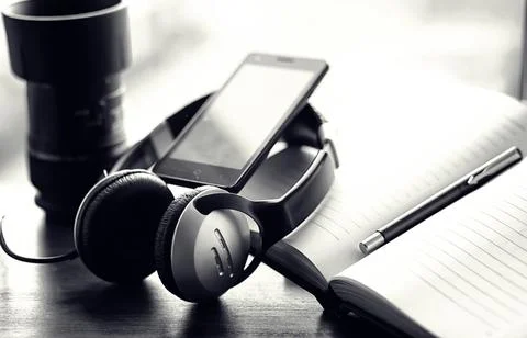 A stack of textbooks with headphone Stock Photos
