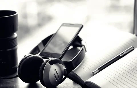 A stack of textbooks with headphone Stock Photos